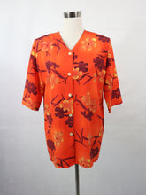 Lataa kuva Galleria-katseluun, Foxi Fashion Pel-Ket Oy made in Finland oranssi kukkakuvioinen lyhythihainen vintagepaita 38