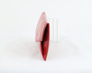 Punainen clutch-laukku
