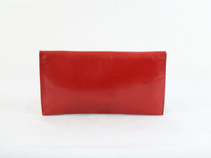 Punainen clutch-laukku