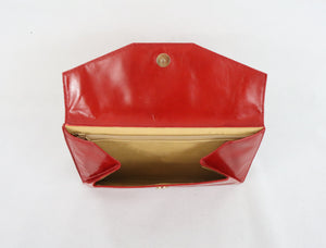 Punainen clutch-laukku