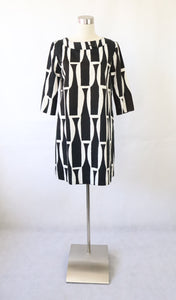 Marimekko puolipituinen mekko mustavakoisella Kivikausi-kuosilla 38