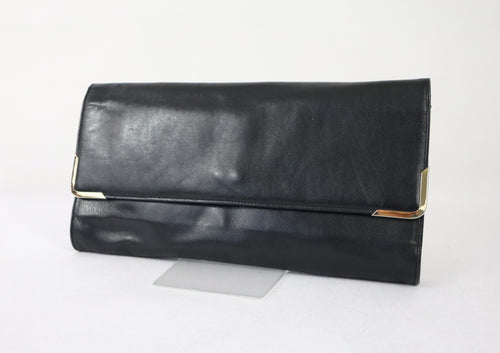 Jubella musta iso clutch-laukku kullanvärisin somistein